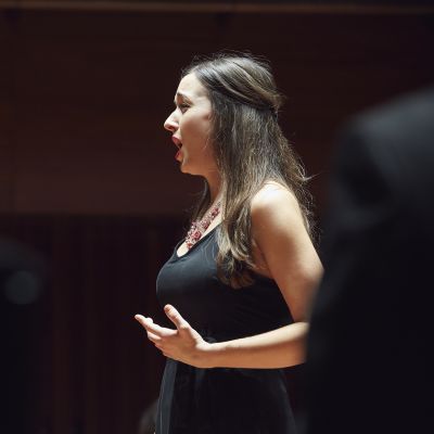 Singer performing on stage in Milton Court